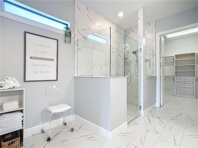 bathroom featuring a shower with door