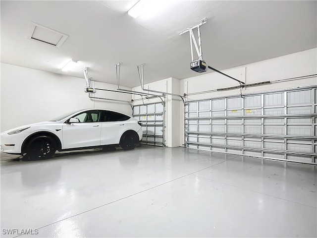 garage featuring a garage door opener