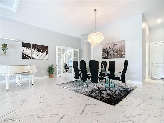 dining area featuring a notable chandelier and french doors