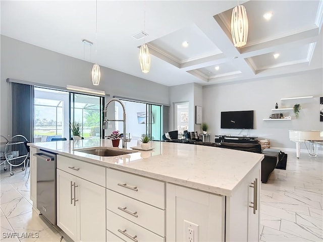 kitchen with white cabinetry, sink, hanging light fixtures, a center island with sink, and coffered ceiling