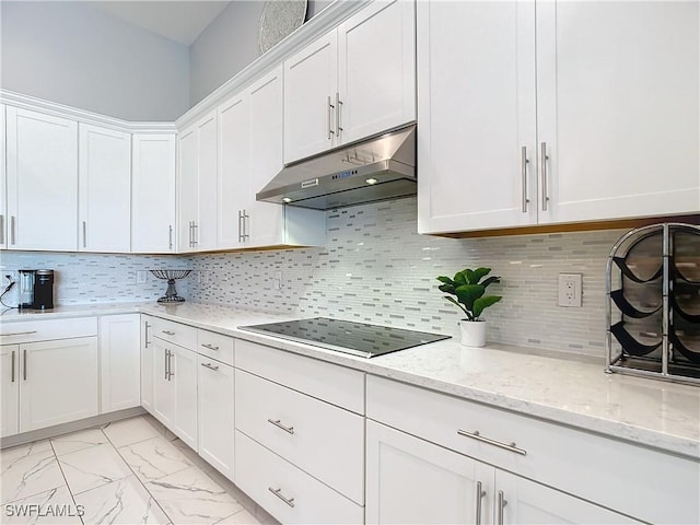 kitchen with white cabinetry, decorative backsplash, and black electric cooktop