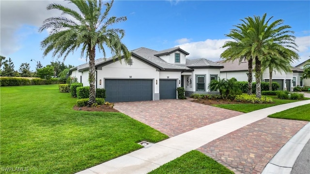 view of front of house with a garage and a front yard