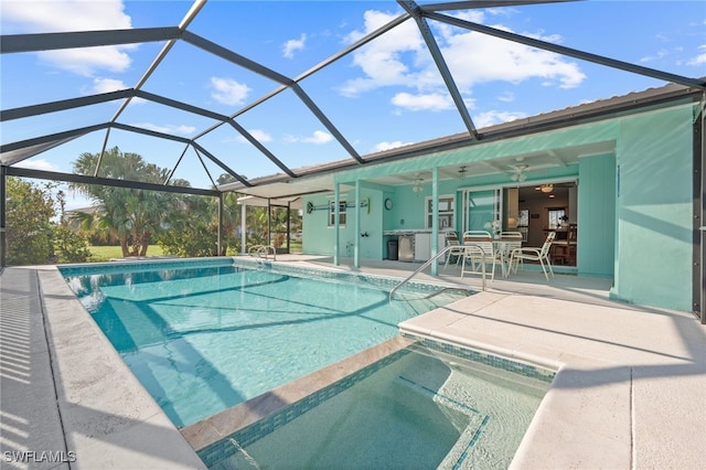 view of pool featuring ceiling fan, a patio, and glass enclosure