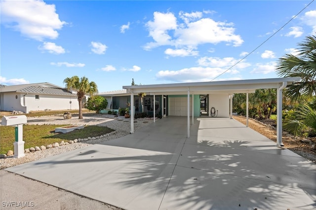 view of front of home with a carport