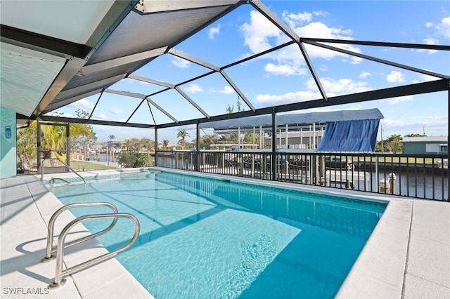 view of pool featuring a patio, a water view, and a lanai