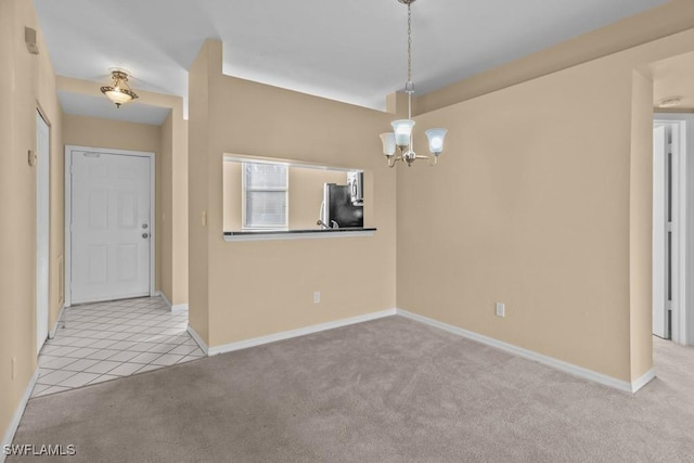 unfurnished dining area featuring a notable chandelier and light colored carpet