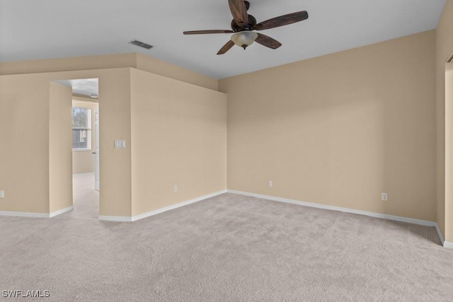 unfurnished room featuring light carpet and ceiling fan