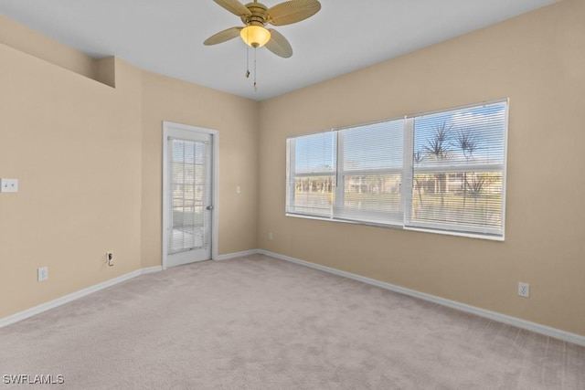 carpeted empty room with ceiling fan