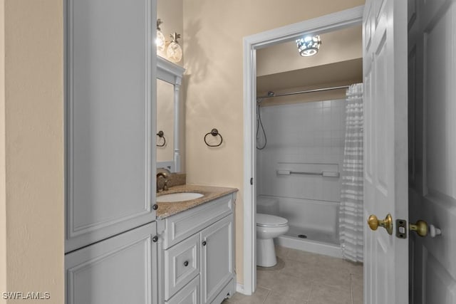 bathroom featuring a shower with shower curtain, vanity, toilet, and tile patterned flooring