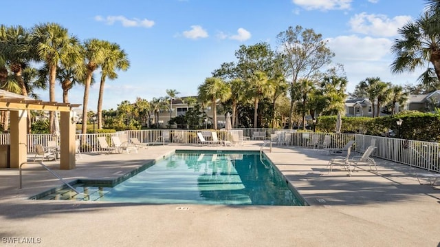 view of pool with a pergola and a patio area