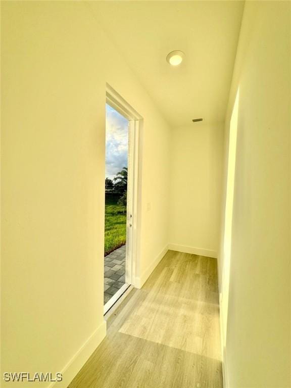 hall with light hardwood / wood-style floors