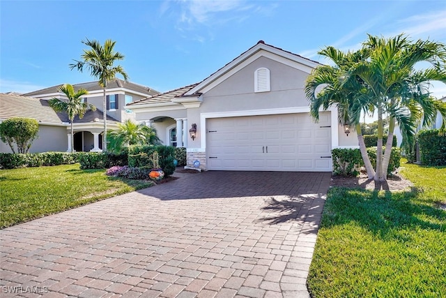 view of front facade featuring a garage and a front lawn