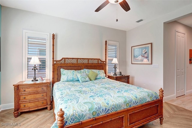 bedroom featuring light parquet floors and ceiling fan