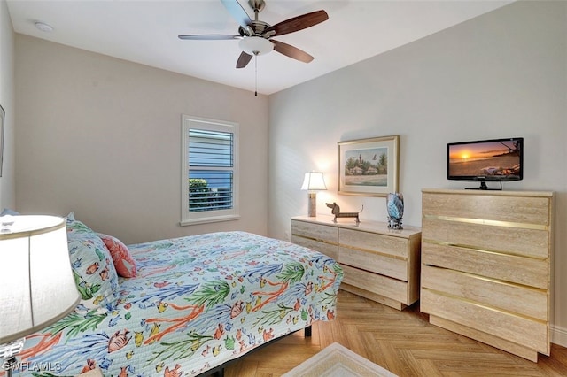 bedroom with light parquet floors and ceiling fan