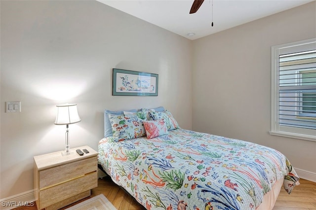 bedroom featuring parquet floors and ceiling fan