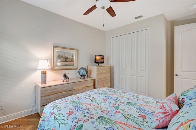 bedroom with ceiling fan and a closet