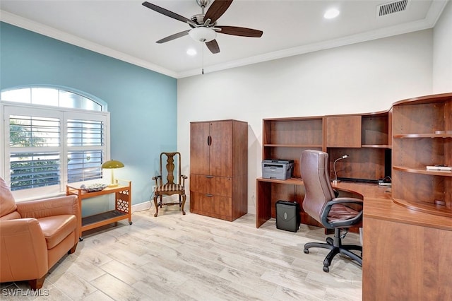 home office featuring ornamental molding, ceiling fan, and light wood-type flooring