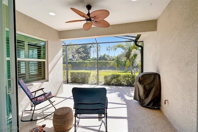 sunroom / solarium with ceiling fan