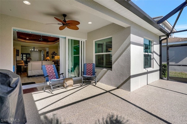 view of patio / terrace with a lanai and ceiling fan