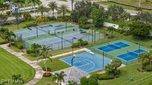 view of sport court featuring a yard and tennis court