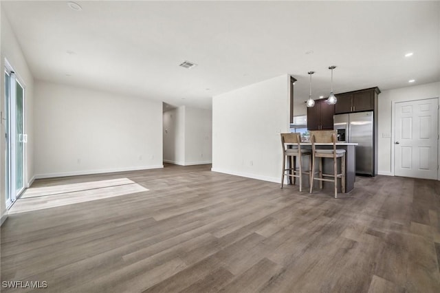 unfurnished living room with hardwood / wood-style floors