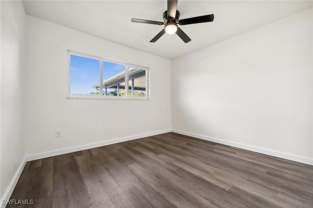 unfurnished room featuring dark hardwood / wood-style floors and ceiling fan