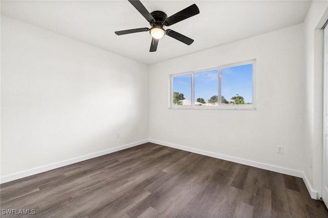 unfurnished room featuring dark hardwood / wood-style floors and ceiling fan