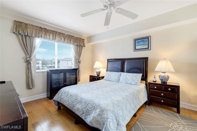 bedroom with hardwood / wood-style flooring and ceiling fan