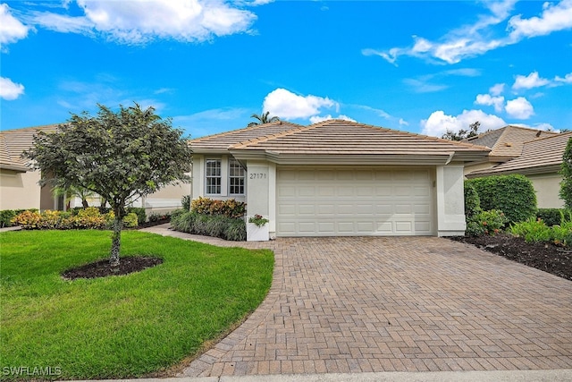 ranch-style house with a front lawn and a garage