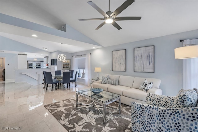 living room featuring ceiling fan and lofted ceiling