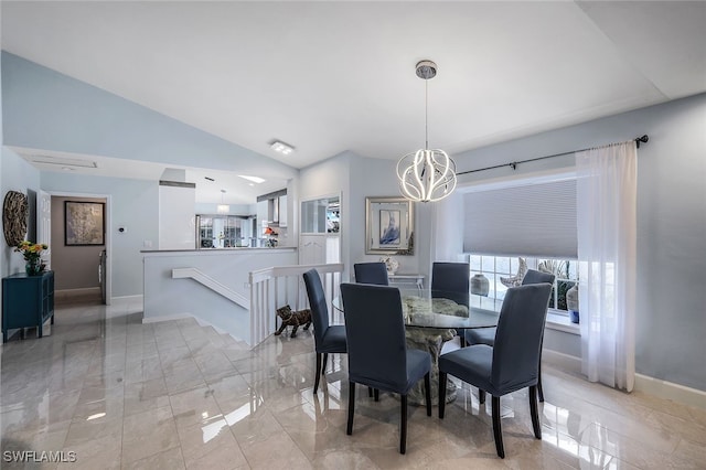 dining area featuring a chandelier and lofted ceiling