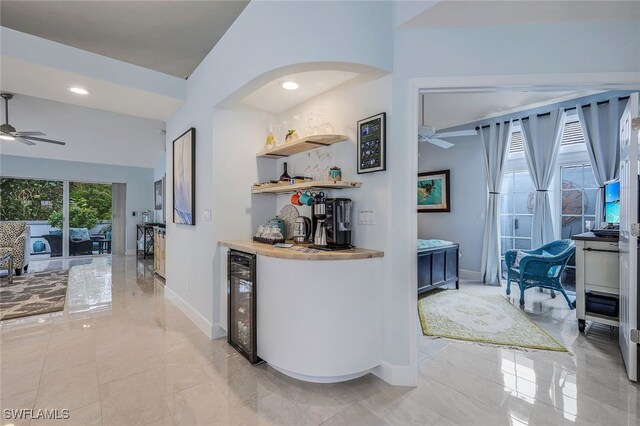 bar featuring ceiling fan and beverage cooler