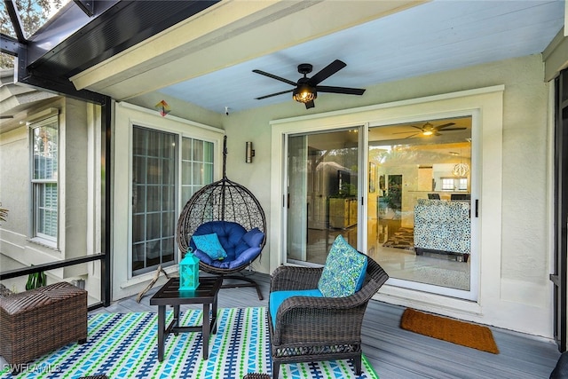 exterior space featuring ceiling fan