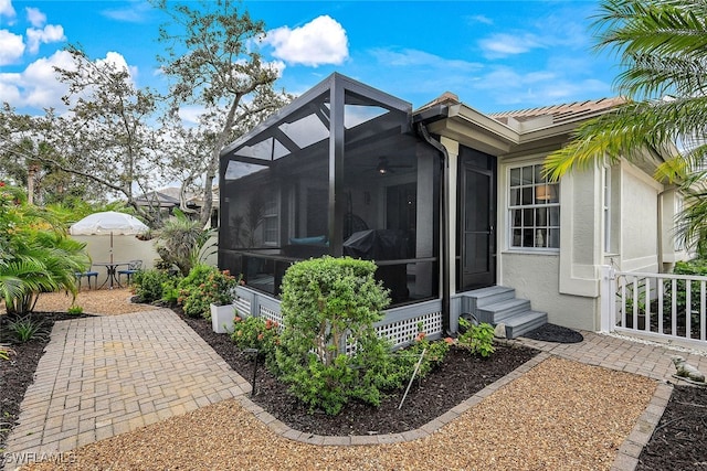 view of side of property featuring a patio area