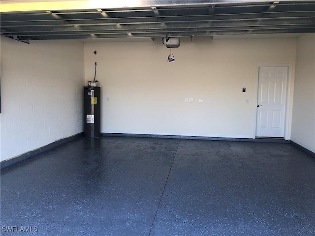 garage with water heater and a garage door opener