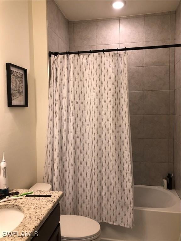 full bathroom featuring vanity, toilet, and shower / bath combo with shower curtain