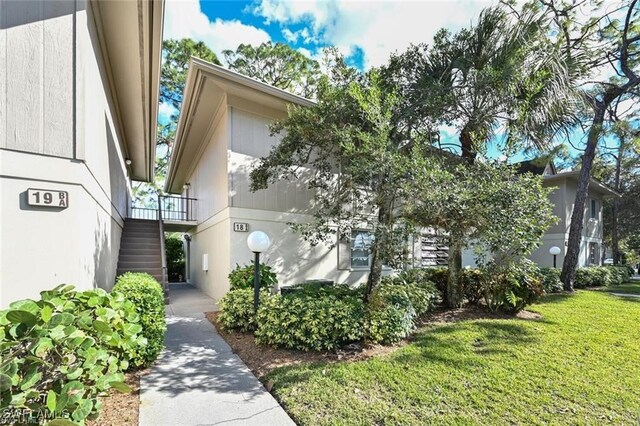 18 Bob O Link Ct Unit 18B, Naples, FL 34105 - view of front of home featuring stairway and a front yard