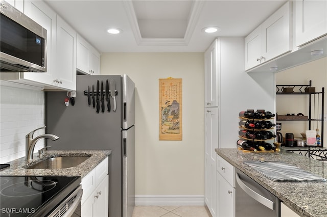 kitchen featuring decorative backsplash, appliances with stainless steel finishes, light stone countertops, light tile patterned flooring, and recessed lighting