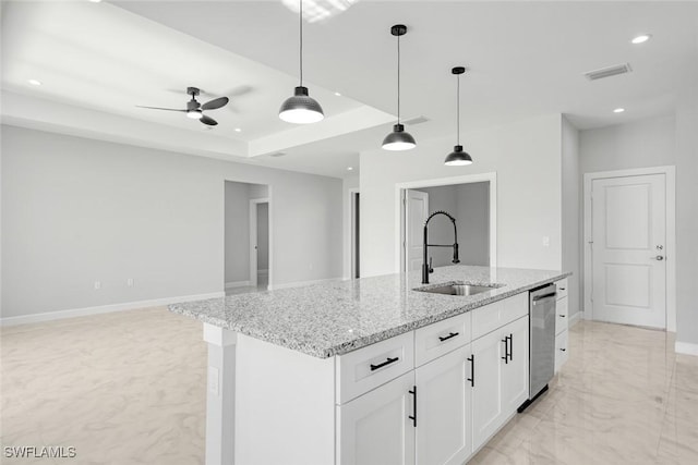 kitchen with light stone countertops, dishwasher, sink, decorative light fixtures, and white cabinets