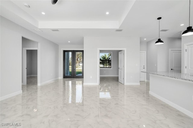 unfurnished living room with french doors