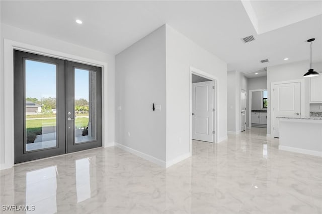 interior space featuring french doors and a healthy amount of sunlight