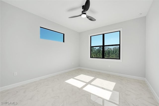 spare room featuring ceiling fan