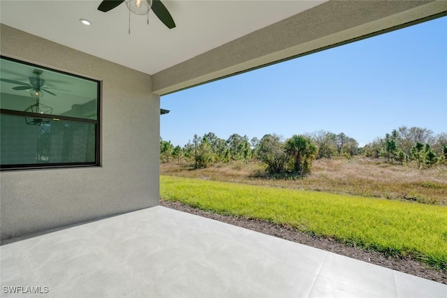 view of patio featuring ceiling fan