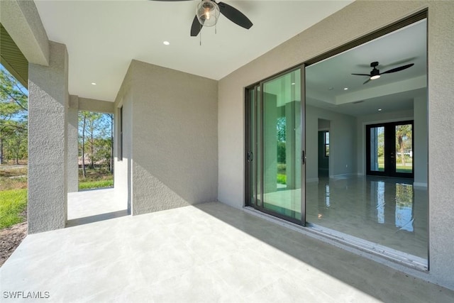 view of patio / terrace with ceiling fan and french doors