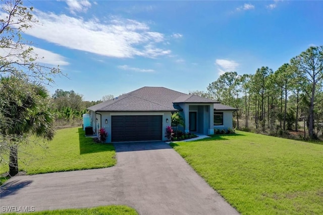 view of front of home with a garage and a front yard