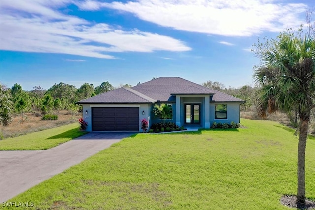 view of front of property with french doors, a garage, and a front lawn