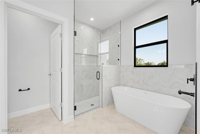 bathroom featuring independent shower and bath and tile walls