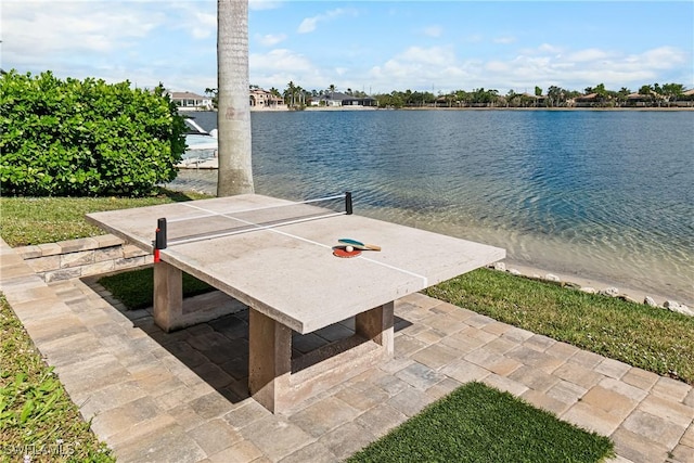 view of patio with a water view