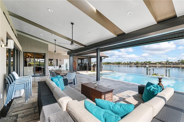 view of patio featuring ceiling fan, a water view, and an outdoor hangout area