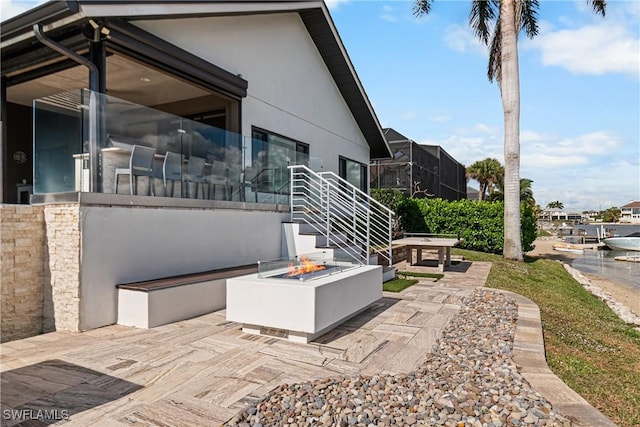 view of patio / terrace featuring a fire pit